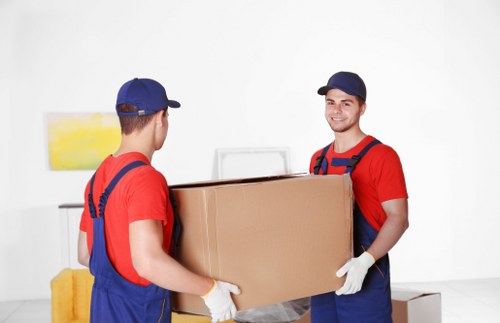 Local Surrey movers organising labelled boxes for a property move