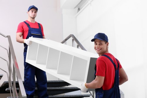 Moving team helping with a Surrey house move on a residential street