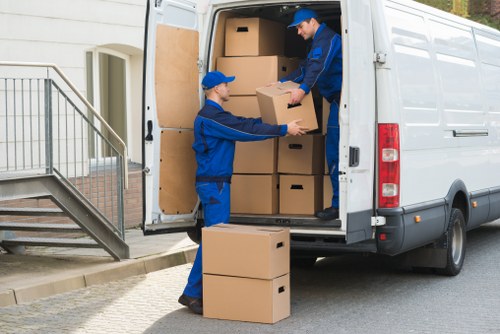 Prepared piano removal process with protective wrapping and secure loading