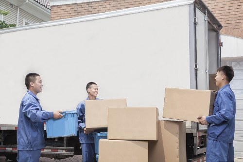 Student moving day with boxes, bags, and furniture ready for collection