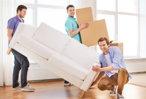 Loading boxes and household items into a van for a Surrey move