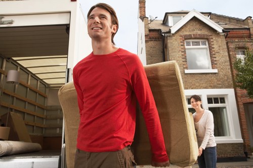 Local Surrey moving truck loading furniture and boxes