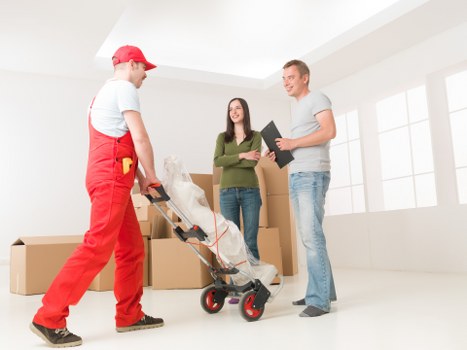 Mover using careful lifting technique with furniture