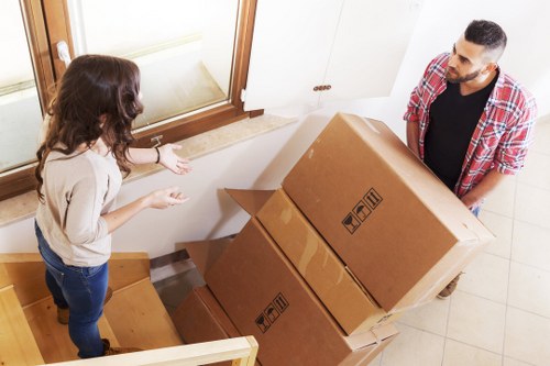 Careful loading of household goods by a local moving team