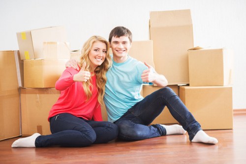 Office desks, boxes, and equipment prepared for relocation in Surrey
